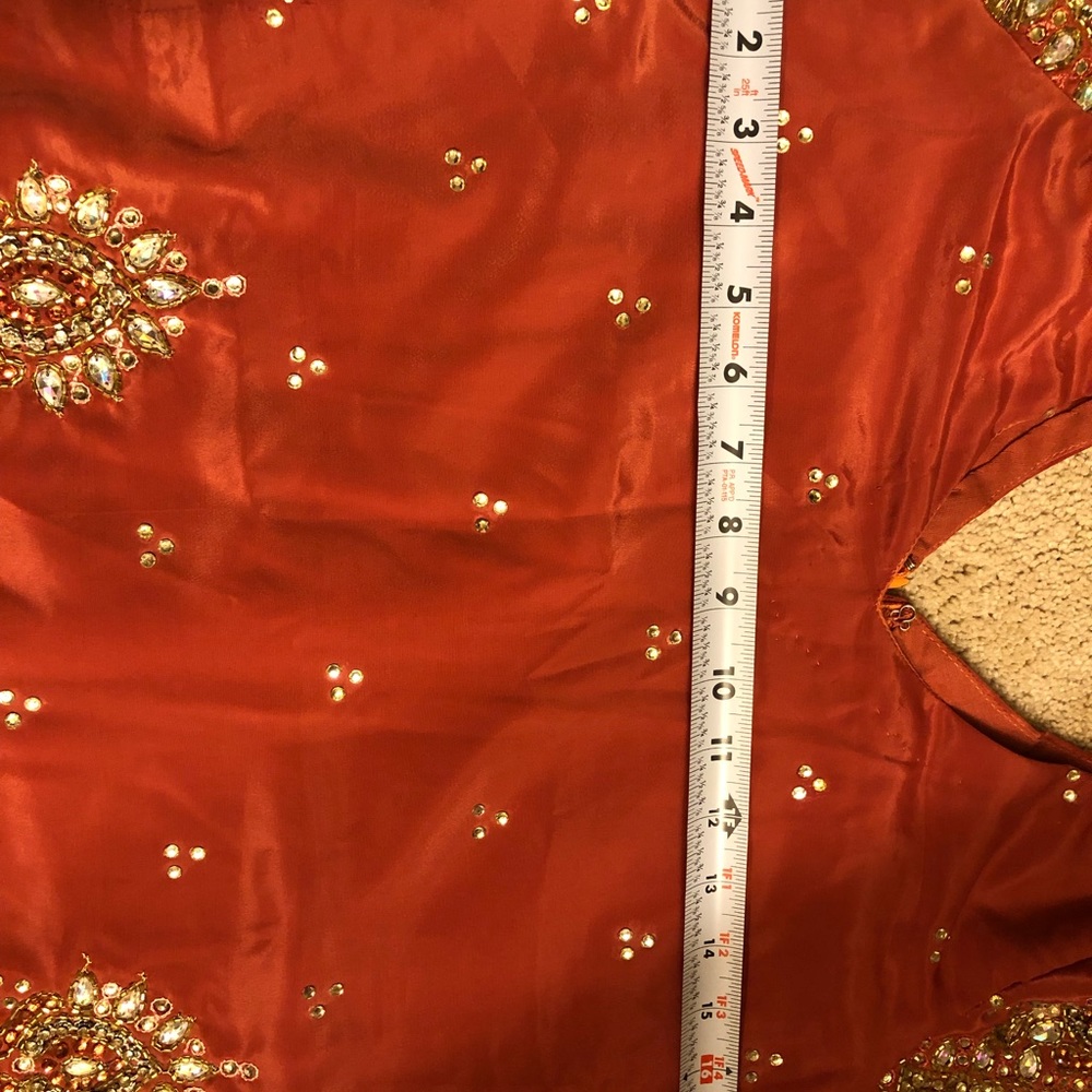 Pakistani heavy suit , peachish colour